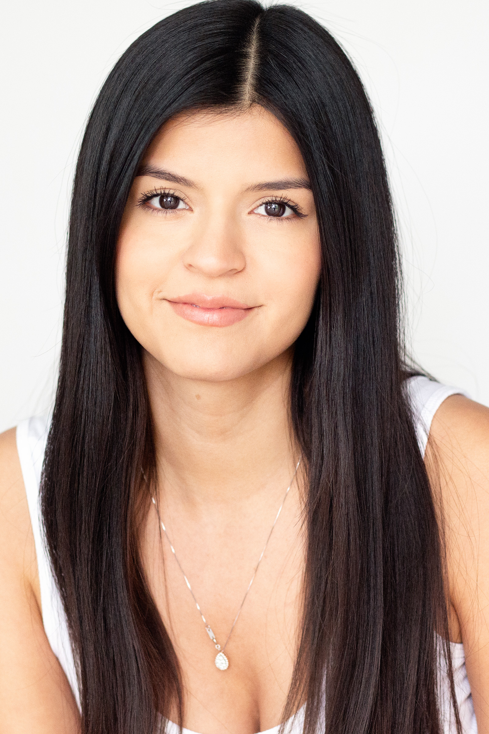 Bright commercial actress headshot with a natural expression