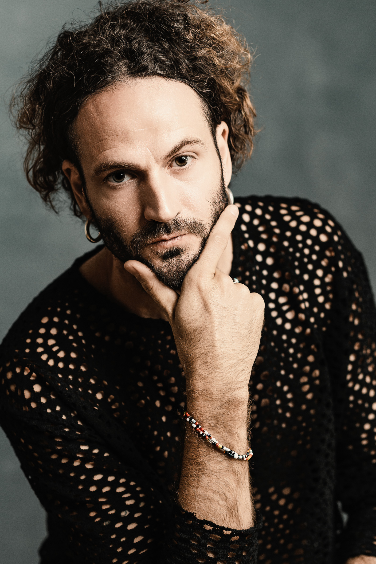Dramatic male actor headshot in a denim jacket