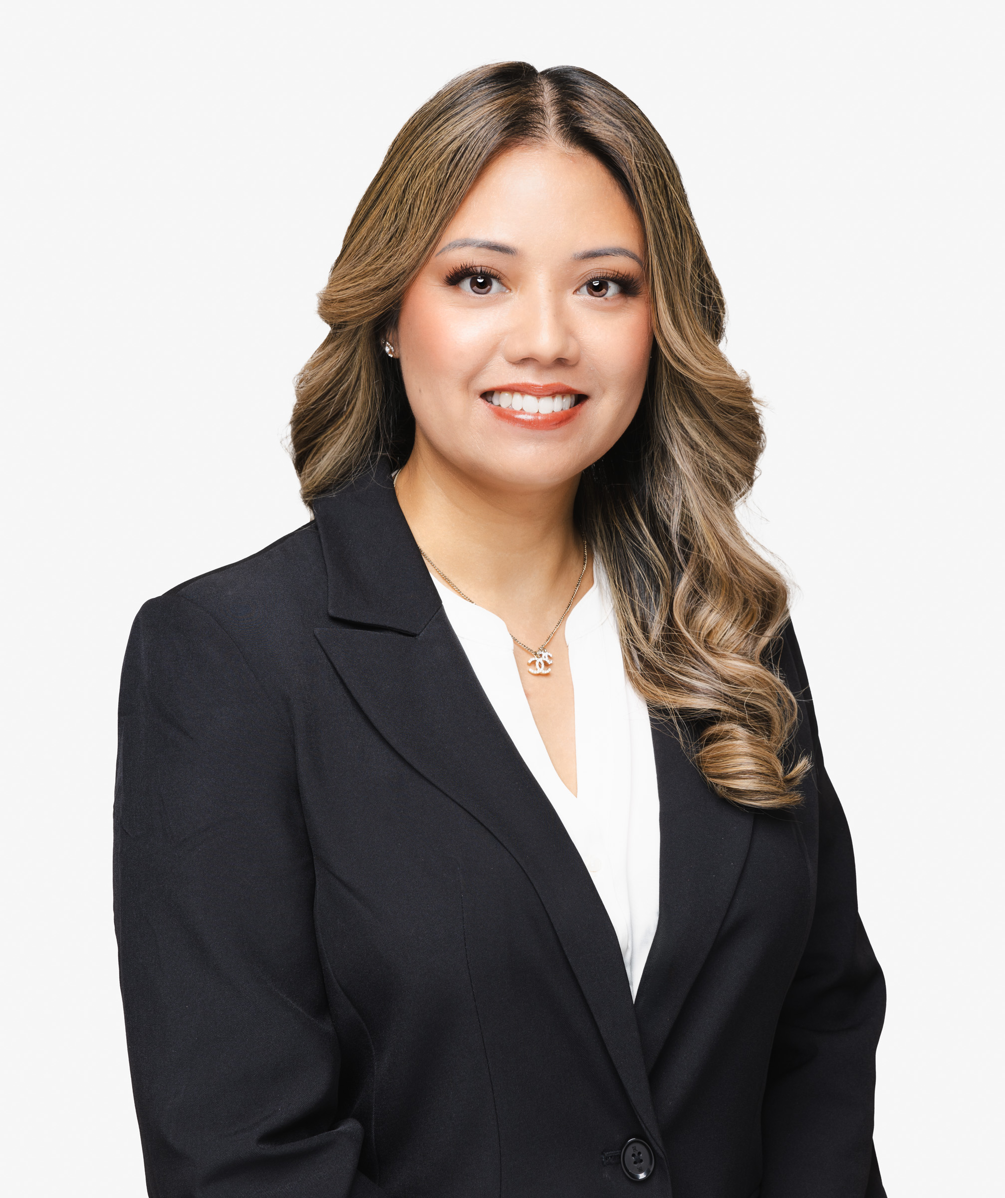 Classic business headshot of a woman against a white backgroun