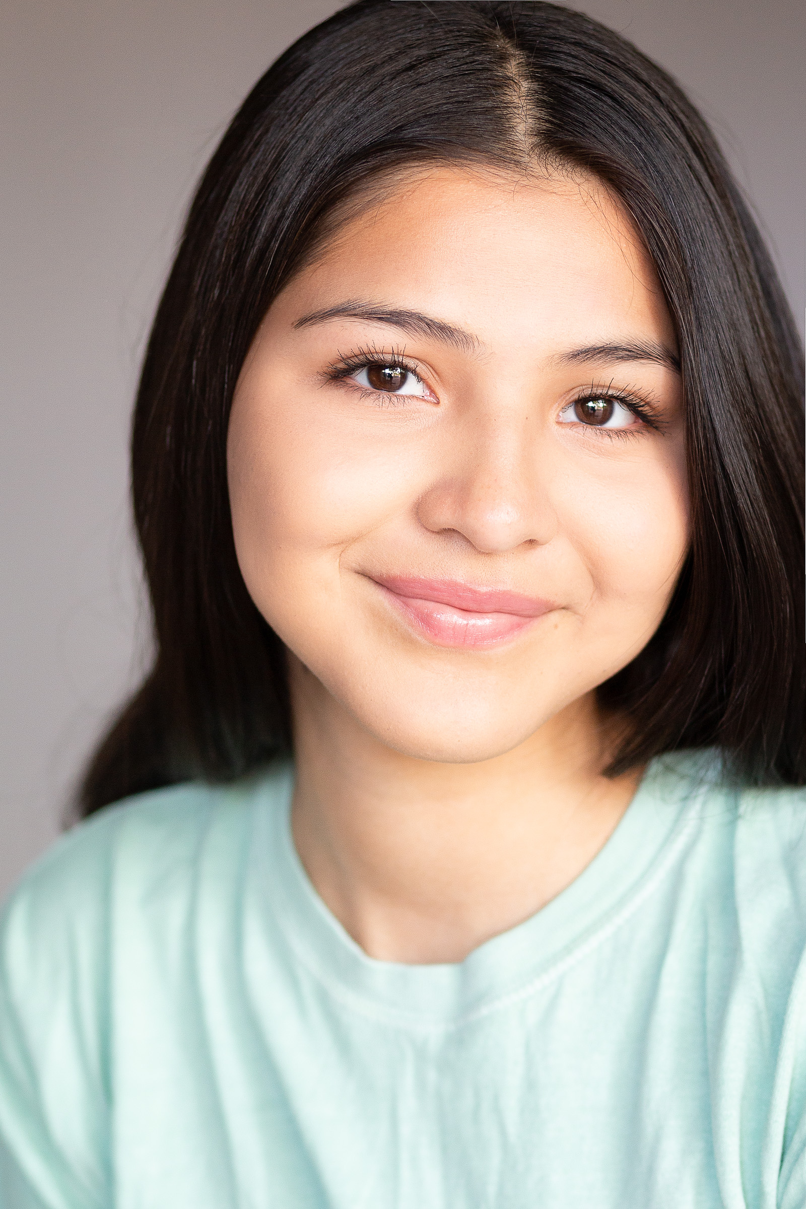 Smiling young actress photographed for a commercial headshot